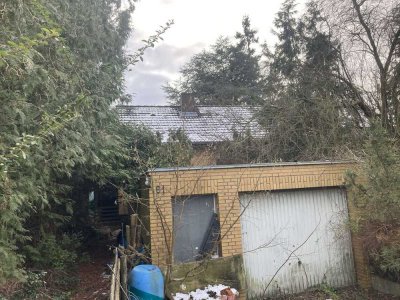 Einfamilienhaus, vollunterkellert und mit Garage