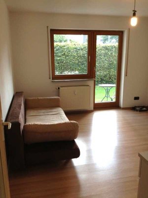 1-ZIMMER APPARTMENT MIT KLEINEM GARTENANTEIL MÖBELIERT, STELLPLATZ