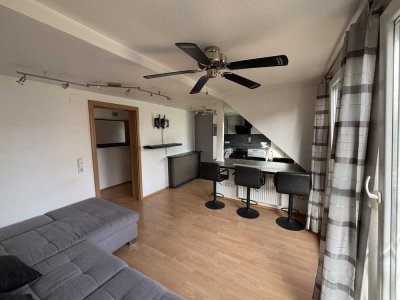 Attraktive 2.5-Zimmer-Dachgeschosswohnung mit Balkon und praktischem Dachbodenabteil