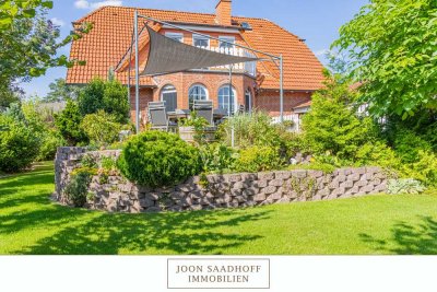 Ein Paradies für Familien – Gepflegtes Einfamilienhaus mit Doppelgarage und idyllischem Garten