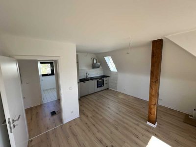 Erstbezug nach Sanierung: stilvolle DG-Wohnung mit Terrasse und EBK in Top-Lage am Kaiserberg