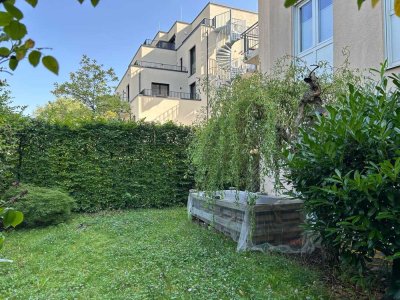 Helle 3-Zimmer-Erdgeschoss-Wohnung mit 60m² Garten hinterm Haus und Tiefgaragenstellplatz in Moosach