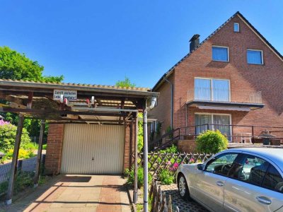 Attraktives Mehrfamilienhaus mit drei Wohneinheiten und Garagen in ruhiger Lage