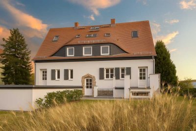 Exklusive Wohnung mit Gartenanteil und Fitness- sowie Saunabereich – Erstbezug nach Sanierung