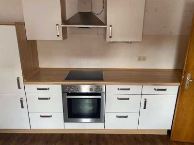 Etagenwohnung mit Einbauküche und Balkon