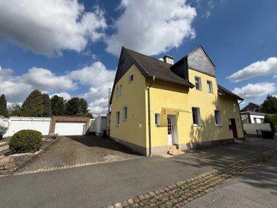 Etwas ganz besonderes! Doppelhaushälfte mit idyllischem Garten, Wintergarten und Doppelgarage.