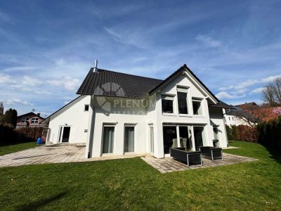 Exklusives Wohngefühl in idyllischer Lage: Luxuriöses Einfamilienhaus mit großzügigem Garten