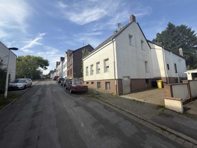 JA, zum vermieteten Zweifamilienhaus mit Garage und großem Garten in Solingen-Merscheid!