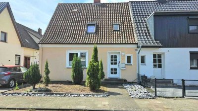 Charme der 30er trifft Familienkomfort – Doppelhaushälfte mit Charakter und Garten in Holtorf