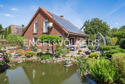 WO WOHNQUALITÄT AUF MÖGLICHKEITEN TRIFFT - EFH MIT GARTEN, KAMIN UND VERMIETETER GEWERBEEINHEIT
