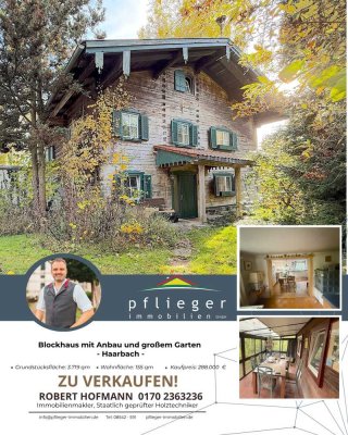 Blockhaus mit Anbau und großem Garten