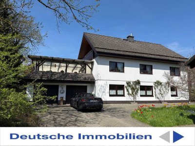 Attraktives Einfamilienhaus mit Einliegerwohnung, Balkon, Terrasse, 3 Garagen!
