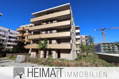Erstbezug: Lichtdurchflutete 4-Zimmer-Wohnung mit Einbauküche und Terrasse mit Garten