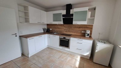 Helle, teilmöblierte 2-Zimmer-Wohnung im Erdgeschoss mit großer Südterrasse und Gartenanteil