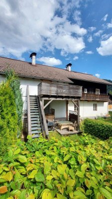 Eigentumswohnung mit großer westseitiger Terrasse, Garten, Garage u. Parkplätze