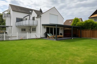 Großzügige Maisonettewohnung mit Haus-im-Haus-Charakter, Garten & 3 Stellplätzen in Bischofsheim