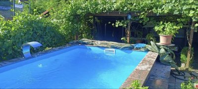 Modernes Wohnen mit Pool, Wintergarten und Ausbaupotenzial – vielseitige Doppelhaushälfte in Bestlag