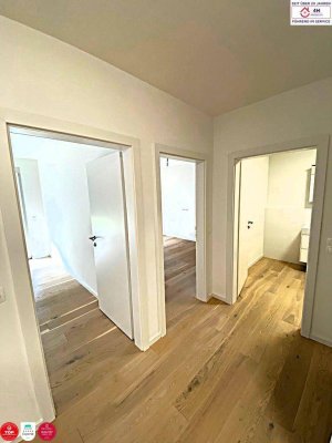 Stylische Gartenwohnung mit Designküche &amp; Tiefgarage – 3-Zimmer-Neubau mit Westterrasse
