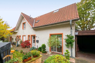 Charmante Doppelhaushälfte mit Gartenidylle, Carport und perfekter Familienlage in Kaltenkirchen