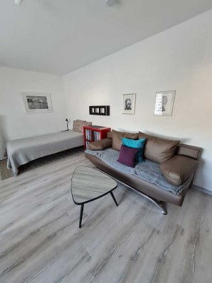 Helle, möblierte 1-Zimmerwohnung mit Küche und Gemeinschaftsgarten