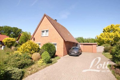 Familienfreundliches Haus mit Ausbaureserve in ruhiger Siedlungslage im Ortskern von Harkebrügge!