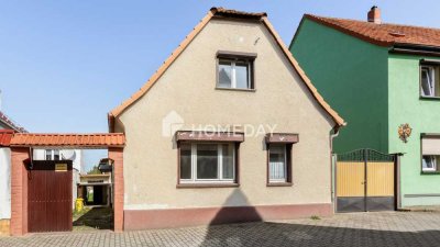 Einfamilienhaus mit Nebengebäuden, Garage, Garten und viel Gestaltungspotenzial