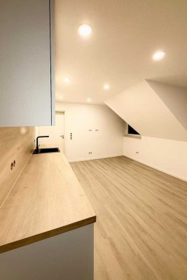 Neuwertige 2-Zimmer-DG Wohnung mit Tiefgaragenstellplatz